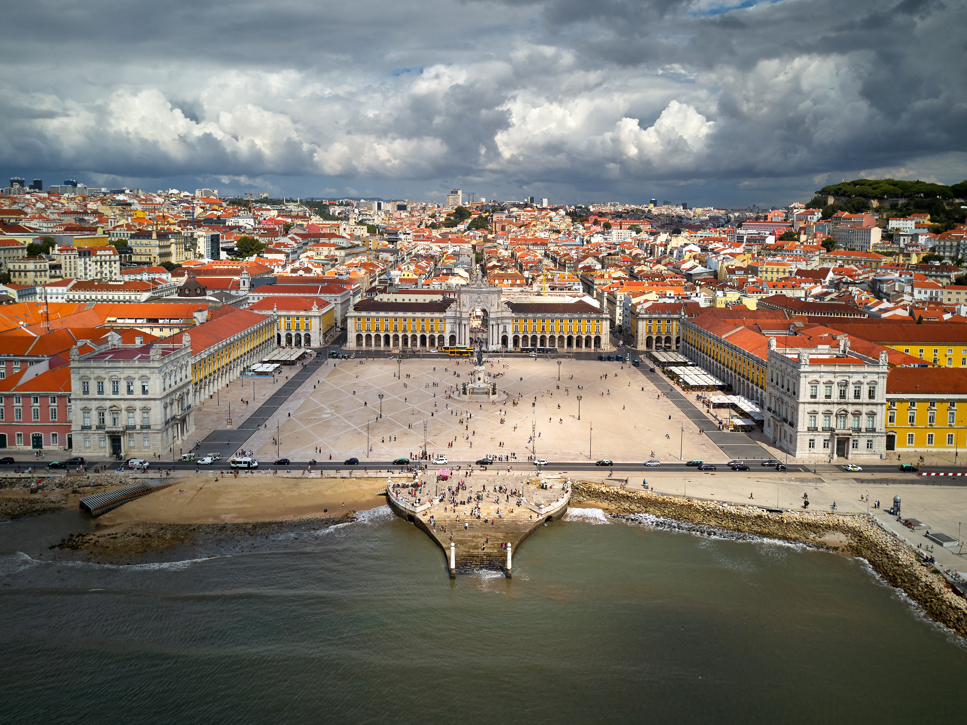 Morning view of Alfama neighborhood in Lisbon with tiled rooftops and the Tagus River