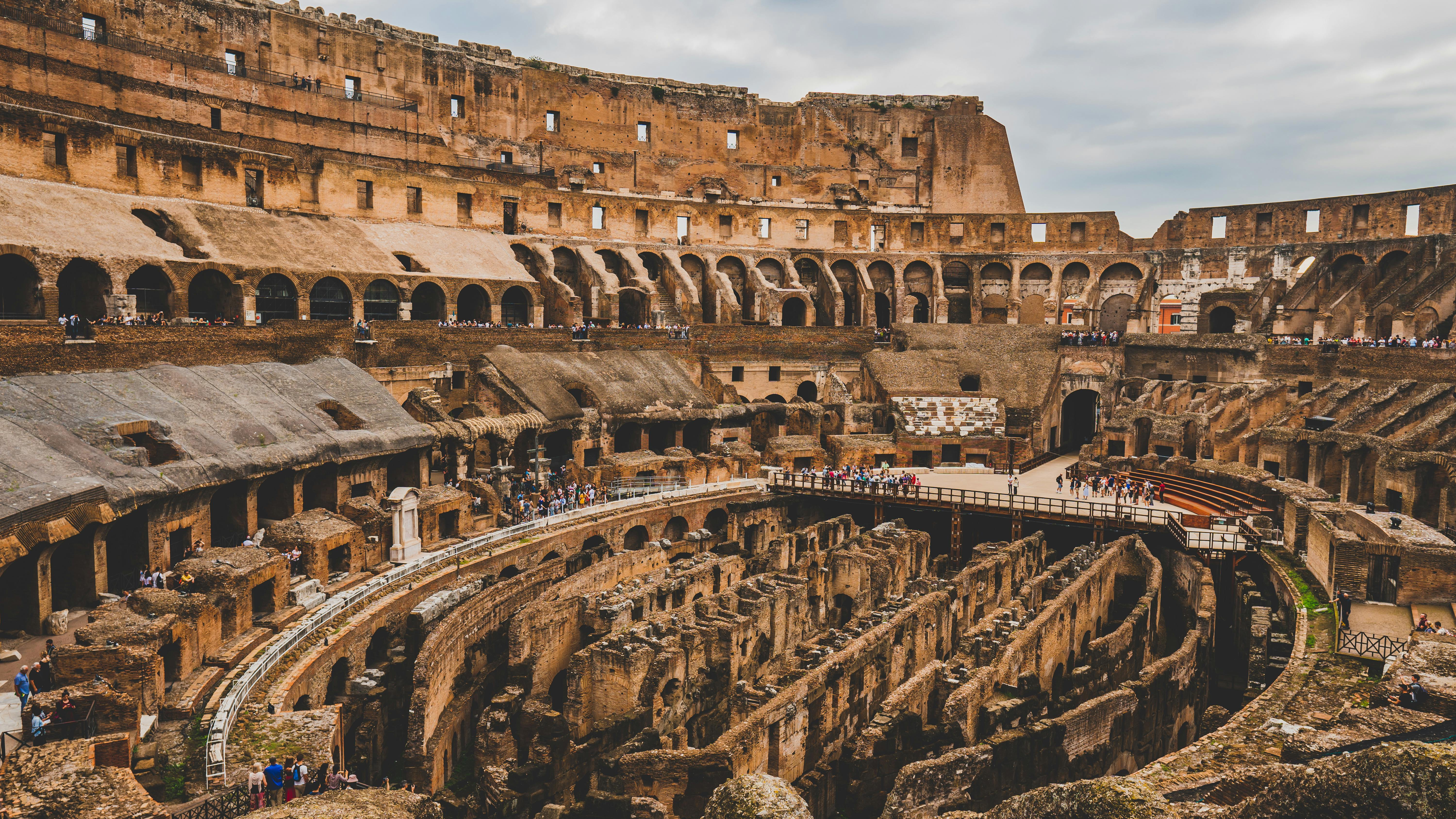 The Colosseum in Rome bathed in early morning light with few tourists